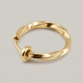 Nep piercing ring gedraaid goud